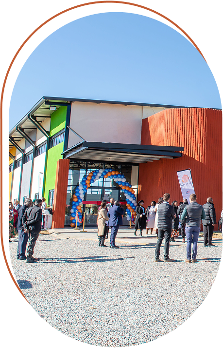 Guests gathering outside a newly opened Khulani school building